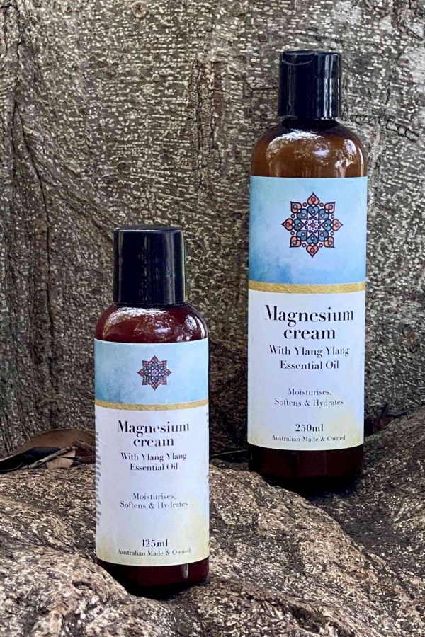 bottles of magnesium cream sitting on a rock background