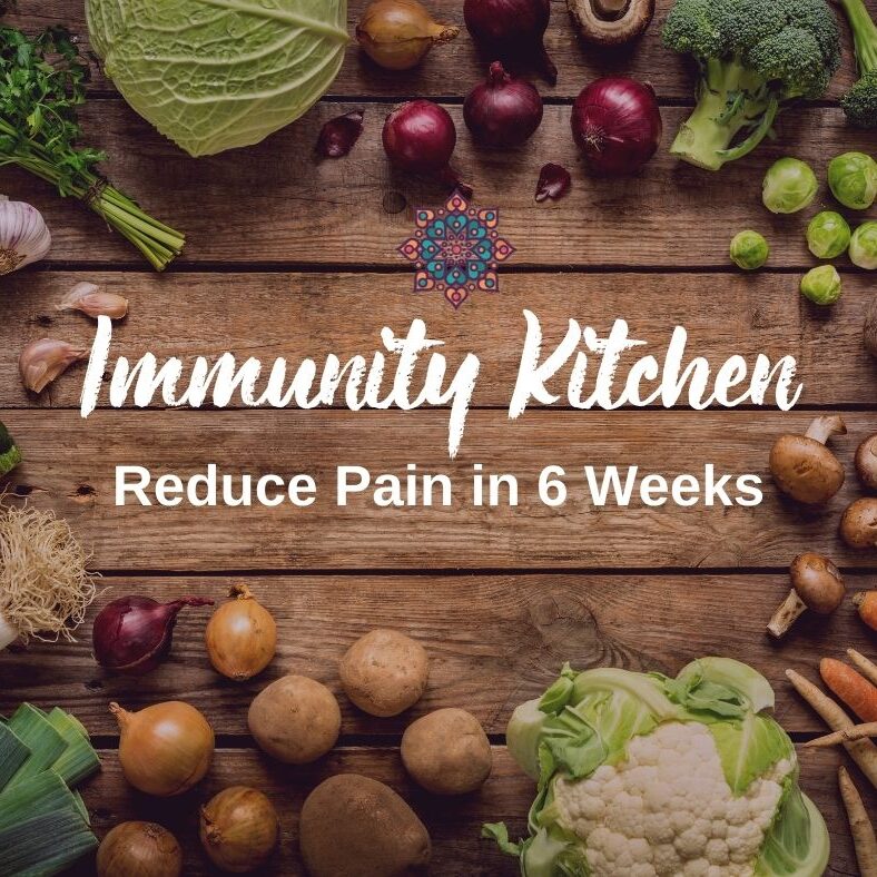Immunity Kitchen logo against a timber table and vegetables background